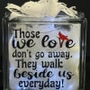 Decorative glass block with a white ribbon and printed quote