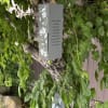 Gray memorial wind chime with two floral-dragonfly panels, bow attached and includes