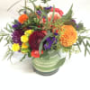 This bright and colorful arrangement comes complete with a variety of dahlias