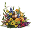 Colorful floral arrangement with a copper urn centerpiece