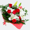 Bouquet of red roses and white lilies wrapped in pink paper