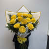 12 long stem yellow roses in a bouquet