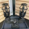 Decorative Egyptian-style statues with a winged bird sculpture in a display tray