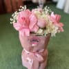 Pink rose bouquet with white hydrangeas in a pink wrapped box