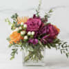 Our Nirvana Garden is a bright, jewel toned centerpiece of premium florals