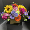 Colorful mixed bouquet with sunflowers, roses, and gerbera daisies in a box