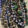 Assorted decorated chocolate candies with ribbon and leaf accents