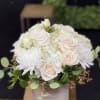 White and blush rose bouquet with white chrysanthemums in a wooden box