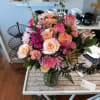 Mixed pink and peach flower bouquet in a glass vase