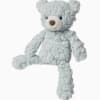 Light blue plush teddy bear with a white snout on a white background