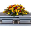 Colorful flower spray arranged on a casket