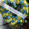 Heart-shaped floral wreath with a silver mother ribbon