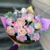 Pale peach roses paired with ruffled pink carnations make this You Are
