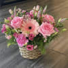 A soft, garden-style bouquet arranged in a woven basket, Sweetest Love Basket