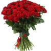 A lush dome of vivid red roses commands the room in this