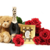 A cluster of vivid red roses takes center stage in this romantic