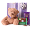 Teddy bear with chocolate bars and a gift bow