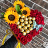 Heart-shaped bouquet of red roses, sunflowers, and gold-wrapped chocolates