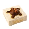 Box of chocolate-covered nuts in cream-colored packaging