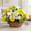This radiant arrangement combines yellow roses, yellow Peruvian lilies, white spray roses