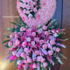 Large pink floral heart and standing spray with roses and lilies
