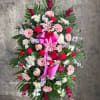 Standing floral spray with pink lilies, roses, and gerbera daisies