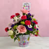 Mixed bouquet in a birthday-themed pot with a Happy Birthday sign