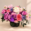 A lavish cluster of pink, lavender, coral and white blooms packed into