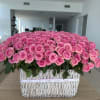 Large basket arrangement of pink roses