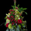 Bright vertical lines of crimson gerbera daisies and red alstroemeria lift this