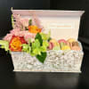 Bright clusters of orange roses paired with orange alstroemeria and yellow tulips