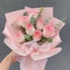 9 pink roses wrapped on paper 