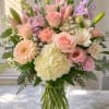 A soft, garden-fresh statement in blush pinks and lavender, this pastel flower