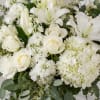 A refined all-white sympathy arrangement, Innocence Remembered brings calm and dignity to