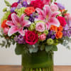 A burst of pink lilies takes center stage in this celebratory flower