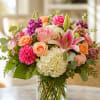 A soft, romantic display of mixed blooms designed to make someone feel