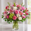 Soft pink lilies and roses take center stage in this European Fields