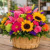 Bright yellow sunflowers and hot pink gerbera daisies make a bold, cheerful