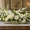 Long, low and quietly sophisticated, this wedding or sympathy centerpiece brings garden-fresh