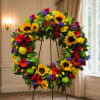 A ring of bold sunflowers greets the eye - a cheerful, garden-style