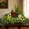 A long, low cremation wreath that brings a calm, natural presence to