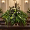 A mossy, pondside statement crafted for a fisherman's memorial-this sympathy flower arrangement