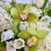 White and green sympathy bouquet with orchids and tulips