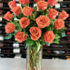 Bouquet of coral roses in a clear glass vase
