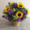 Sunflowers take center stage in this cheerful sunflower arrangement, a bright choice