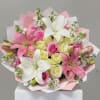 Bouquet of pink and white lilies with pink and pale yellow roses
