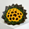 Bouquet of yellow sunflowers with dark centers and fern accents