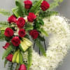 Red roses and white flowers arranged on standing easels