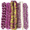 Several purple and yellow flower leis arranged side by side.