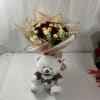 Bouquet of red and white roses with a teddy bear